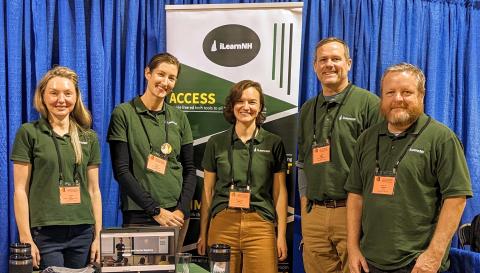 iLearnNH Team Photo with banner behind