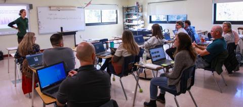 Lucy presents to a group of K12 teachers in New Hampshire